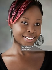 Smirking Black Teenage Lady With Colorful