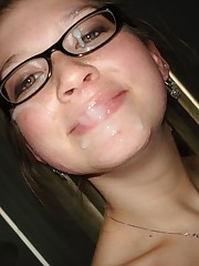 Chick takes hot cum all over her face.